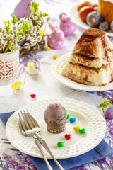 Table setting. Easter table with Easter eggs and easter orthodox sweet bread.