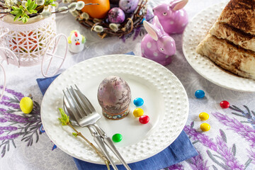 Table setting. Easter table with Easter eggs and easter orthodox sweet bread.