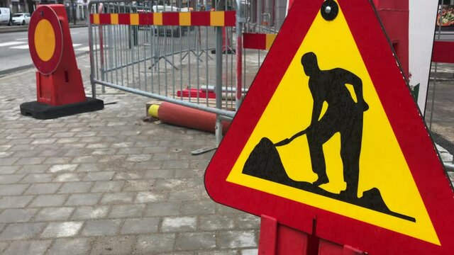 Work on the road sign in the street 