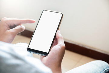 close up of boy's hands is using smart phone with blank screen.