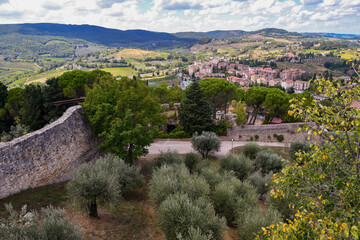 Fototapeta na wymiar Elevated view of the Tuscan countryside from the Rocca di Montestaffoli, a fortress built in the fourteenth century in the municipality of San Gimignano, Siena, Tuscany, Italy