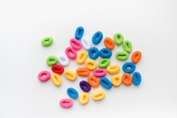 colored elastic bands for hair on a white background