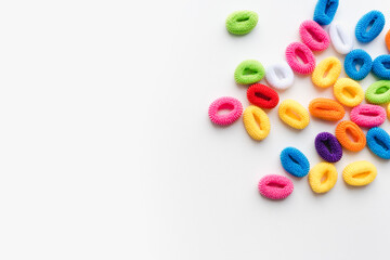 colored elastic bands for hair on a white background