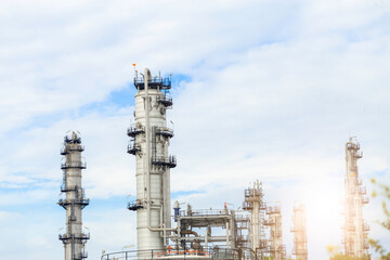Industrial of oil refinery plant from industry zone ,Refinery factory oil storage tank and pipeline steel with blue sky.