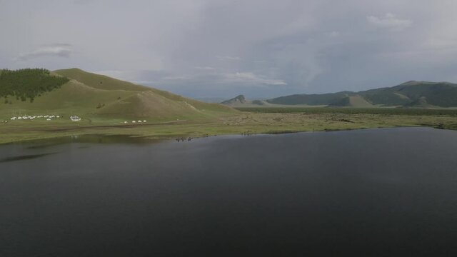 drone footage of grassland and wide Terkhiin Tsagaan lake at Mongolia 