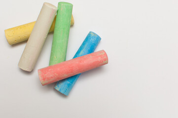 Colorful chalk pastels for kids in white paper