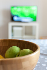 Television, TV watching with bowl of fruit lying on table