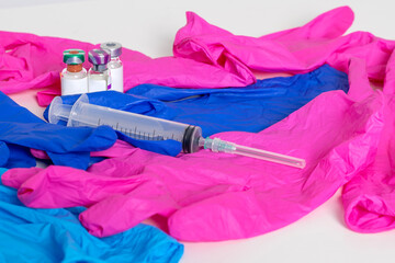 Medical ampoules, protective gloves and syringe