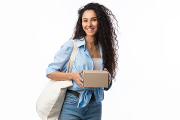 Fototapeta premium Lady Holding Box Posing With Eco Bag Over White Background