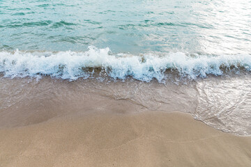 Close up of sea ocean wave on sandy beach