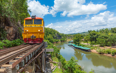 Kanchanaburi Province, Locomotive, Steam Train, Thailand, Train,World war II historic railway, known as the Death Railway with a lot of tourists on the train taking photos of beautiful views over Kwai