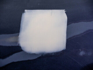 car putty on yellow car parts.