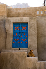 Blue door of a house in a omani  oasi village .