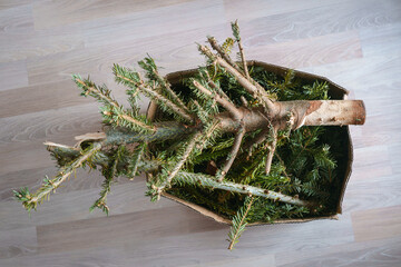 easy way to get rid of the Christmas tree when the holidays are over, chop it up and put it in a box