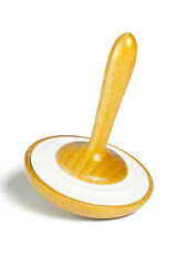 Wooden whirligig or spinning top toy for children isolated on a white background. Close-up. Vertical photo.