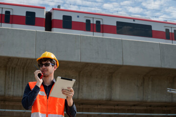 male construction worker talking on radio communication.
