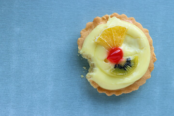 bitten off a cake Panna cotta with fruits in baskets