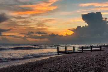 A view along the shore at Worthing, Sussex at sunset