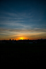 Photos of the sunset at the end of the day with the outline of the buildings in londrina, parana, brazil
