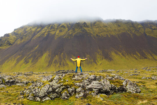 Man standing on rocks, Sn�fellsnes peninsula, West Iceland