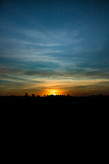 Photos of the sunset at the end of the day with the outline of the buildings in londrina, parana, brazil