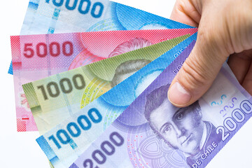 Chile money, Banknotes, Pesos, held in the hand