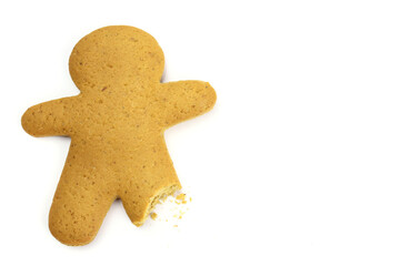 Gingerbread man with broken leg isolated on white