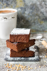 Buckwheat brownie on grey background
