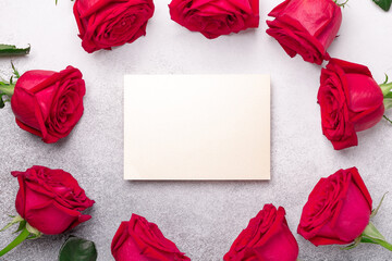 Valentine's day blank card with red rose flowers on stone background. Valentines day mockup