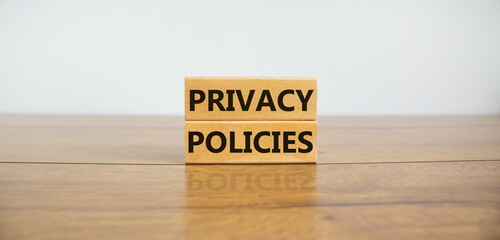 Privacy policies symbol. Concept words 'Privacy policies' on wooden blocks on a wooden table....