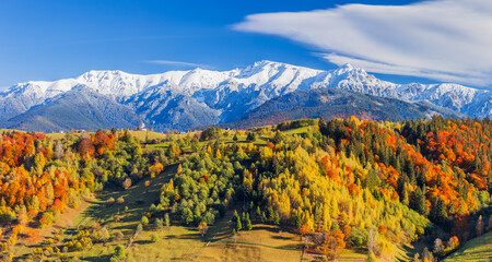 Autumn in Moeciu Village. Panorama of the rural landscape in the Carpathians, Romania. - obrazy, fototapety, plakaty