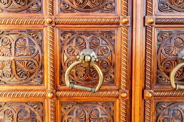 Wooden door with door knob made of bronze
