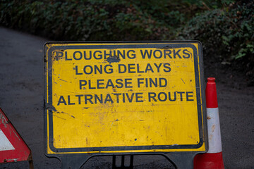 Ploughing Works Long Delays mis-spelt road sign