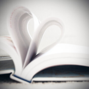 Book pages in heart shape. Booklover or love reading concepts.