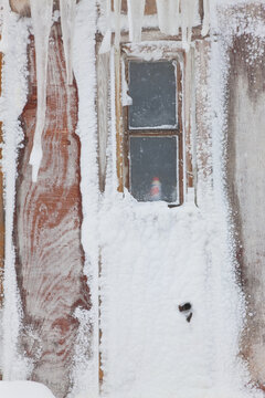 Ice framed windows of a house in a village in Greenland