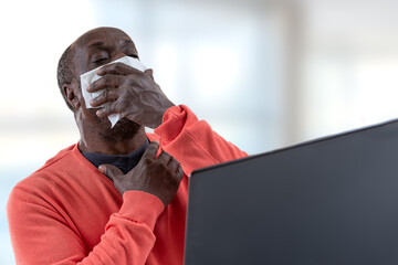 Telemedicine concept - African male patient consult her health condition to doctor in front of...