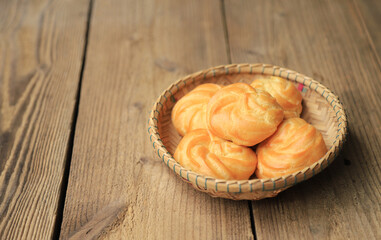 sweet dessert elclair in basket for eating at home 