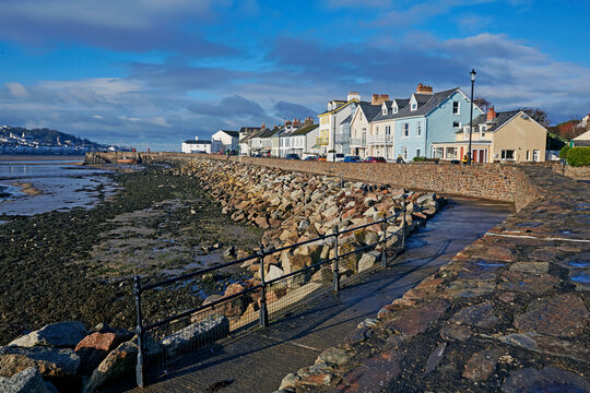 Houses in a row with sea defences in the small town of Instow in North Devon