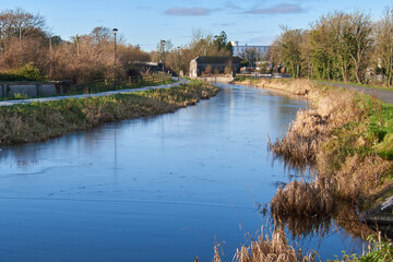 Thin blue ice on Royal canal in Mullingar town . Ireland.
