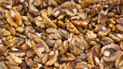 Background of walnuts close up from above healthy food concept
