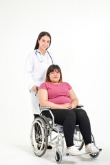 Beautiful female doctor Cure ailments of obese women patients Asians seated on a wheelchair. Obesity is a health problem for the body. Concept of losing weight. Copy space. white background