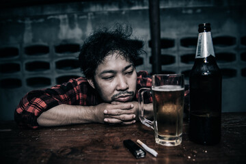 Asian man drink vodka alone at home on night time,Thailand people,Stress man drunk concept