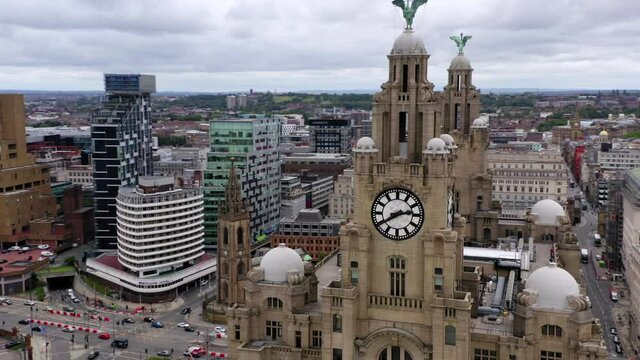 Liverpool Liver building wide drone rotaions shot showing liver birds ontop and city paralaxed in background. 4K 25FPS 10bit DLOG-REC709