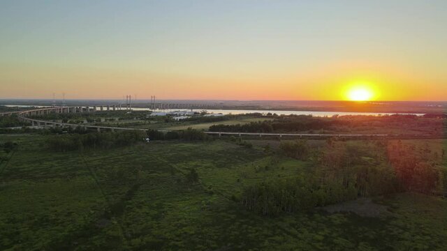 Aerial wide view of the Zarate Brazo Largo bridge crossing Parana river at sunset