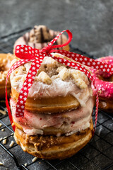 Vegan Donuts with a Red Ribbon on Dark Background and Baking Rack, Donut Gift