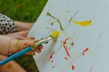 Baby painting with brush