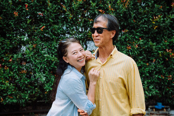 Fototapeta premium Portrait of asian senior couple in summer park.