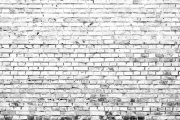 Texture of a brick wall with cracks and scratches which can be used as a background