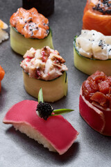 Sushi set to roll and nigiri with tuna, salmon, rice caviar, and Philadelphia cheese