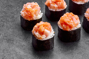 Sushu set with salmon, tuna, philadelphia cheese and rice on the dark background